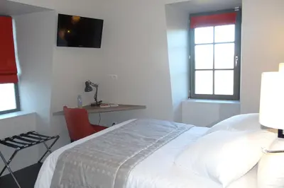 Un ou plusieurs lits dans un hébergement de l'établissement Parc Hôtel Pompadour