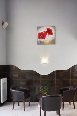 Coin salon dans l'établissement Kyriad Limoges Sud - Feytiat