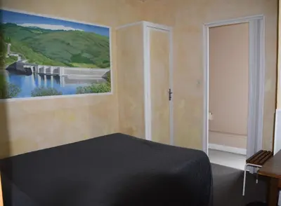 Un ou plusieurs lits dans un hébergement de l'établissement Hôtel Le Rider