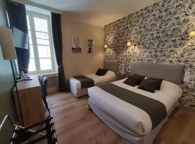 Un ou plusieurs lits dans un hébergement de l'établissement Le Pavillon Saint-Martin