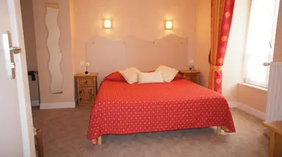 Un ou plusieurs lits dans un hébergement de l'établissement Auberge De Raulhac