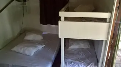 Un ou plusieurs lits dans un hébergement de l'établissement La Ptite Ferme de Caro