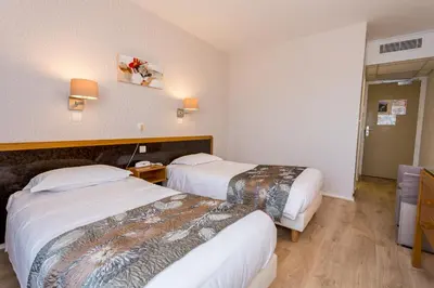 Un ou plusieurs lits dans un hébergement de l'établissement Hôtel Restaurant du Château