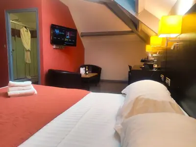 Un ou plusieurs lits dans un hébergement de l'établissement Contact Hotel B&G Limoges Sud