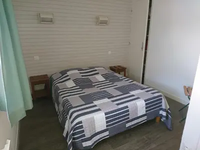 Un ou plusieurs lits dans un hébergement de l'établissement Les Appartements de Johann