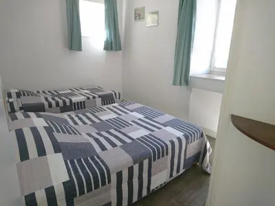 Un ou plusieurs lits dans un hébergement de l'établissement Les Appartements de Johann