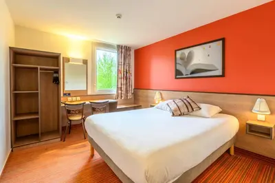 Un ou plusieurs lits dans un hébergement de l'établissement Ace Hotel Brive