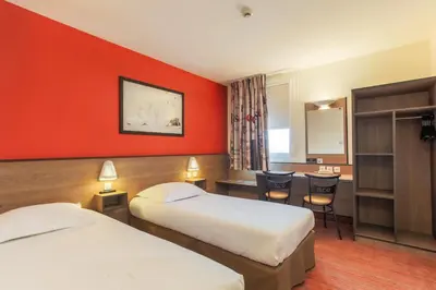 Un ou plusieurs lits dans un hébergement de l'établissement Ace Hotel Brive