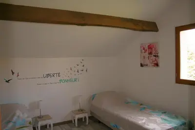 Un ou plusieurs lits dans un hébergement de l'établissement Liabaquet Gîtes