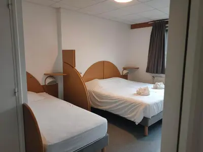Un ou plusieurs lits dans un hébergement de l'établissement VVF Le Lioran Les Monts du Cantal