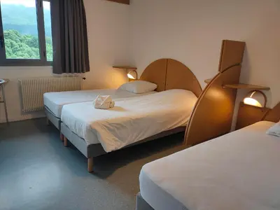 Un ou plusieurs lits dans un hébergement de l'établissement VVF Le Lioran Les Monts du Cantal