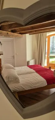 Un ou plusieurs lits dans un hébergement de l'établissement La Grange - Gite Mur de Barrez