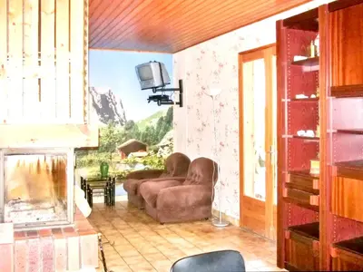 Coin salon dans l'établissement Chalet charmant à Saint-Gérons avec piscine partagée