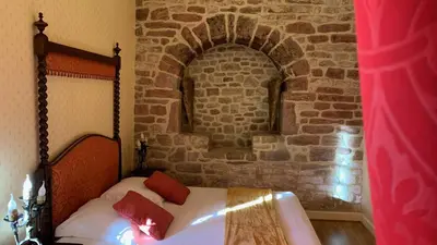 Un ou plusieurs lits dans un hébergement de l'établissement Le Moulin du Boisset