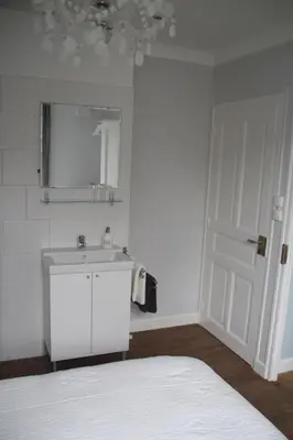 Un ou plusieurs lits dans un hébergement de l'établissement Apartment Fleur de Lys Bleue
