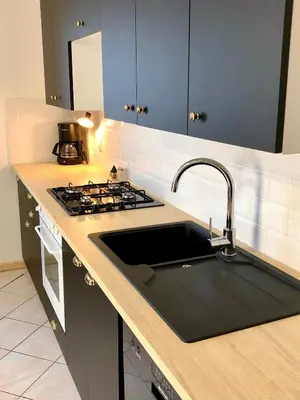 Cuisine ou kitchenette dans l'établissement Le Moulin Aux Ans