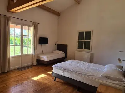 Un ou plusieurs lits dans un hébergement de l'établissement Luxury villa near the cute towns of Sarlat and Rocamadour