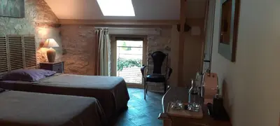 Un ou plusieurs lits dans un hébergement de l'établissement Chambre d'hôtes Au Picatal