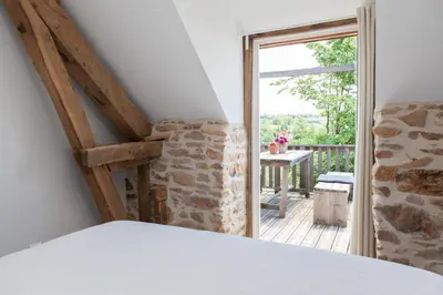Un ou plusieurs lits dans un hébergement de l'établissement B&B Fleur de Lys Bleue