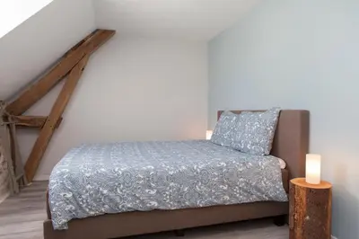 Un ou plusieurs lits dans un hébergement de l'établissement B&B Fleur de Lys Bleue