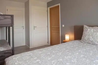 Un ou plusieurs lits dans un hébergement de l'établissement B&B Fleur de Lys Bleue
