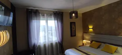Un ou plusieurs lits dans un hébergement de l'établissement Hotel Belle Vue