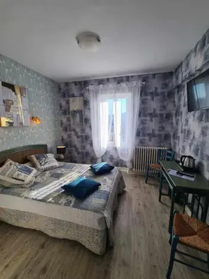 Un ou plusieurs lits dans un hébergement de l'établissement Hotel Belle Vue