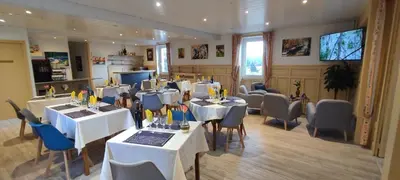 Télévision ou salle de divertissement dans l'établissement Hotel Belle Vue