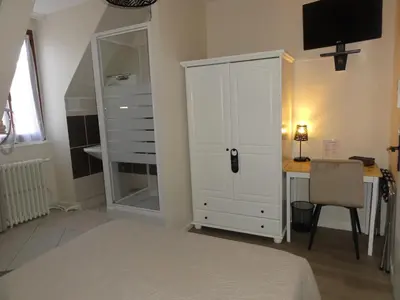 Un ou plusieurs lits dans un hébergement de l'établissement Hotel des Voyageurs