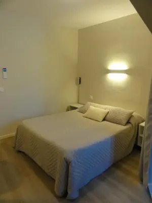 Un ou plusieurs lits dans un hébergement de l'établissement Hotel des Voyageurs