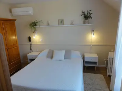 Un ou plusieurs lits dans un hébergement de l'établissement Hotel des Voyageurs