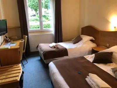 Un ou plusieurs lits dans un hébergement de l'établissement Logis Hôtel restaurant Bel Horizon