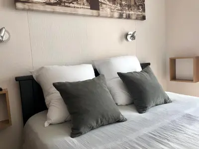 Un ou plusieurs lits dans un hébergement de l'établissement Residence Soleil des Thermes 2