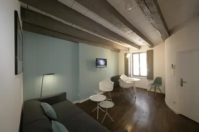 Coin salon dans l'établissement Les Maisons du Pont - Charme & Caractère