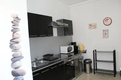 Cuisine ou kitchenette dans l'établissement Cottage de Noëlle