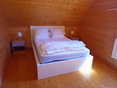 Un ou plusieurs lits dans un hébergement de l'établissement Chalet charmant à Saint-Gènes-Champespe avec parking privé