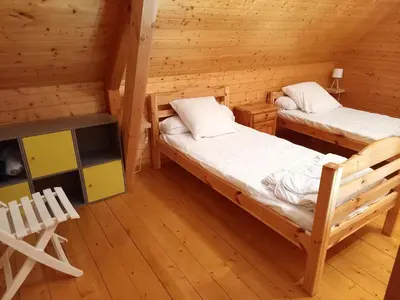 Un ou plusieurs lits dans un hébergement de l'établissement Chalet charmant à Saint-Gènes-Champespe avec parking privé