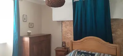 Un ou plusieurs lits dans un hébergement de l'établissement La Maison De Béatrice