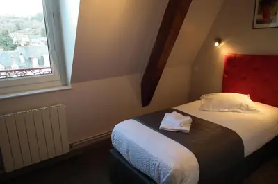 Un ou plusieurs lits dans un hébergement de l'établissement Hôtel de l'Aviation