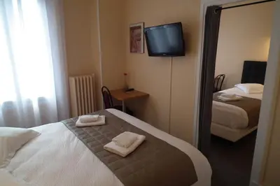 Un ou plusieurs lits dans un hébergement de l'établissement Hôtel de l'Aviation