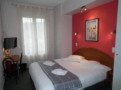 Un ou plusieurs lits dans un hébergement de l'établissement Hôtel de l'Aviation