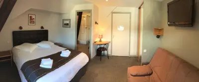 Un ou plusieurs lits dans un hébergement de l'établissement Hôtel de l'Aviation