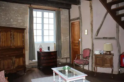 Coin salon dans l'établissement Villa La Roseraie avec accès piscine Hôtel La Roseraie