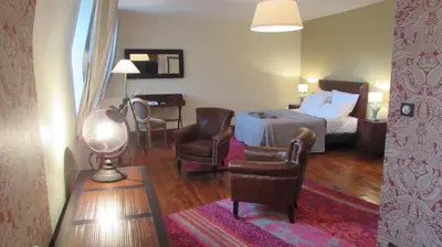 Coin salon dans l'établissement Auberge Les Volcans