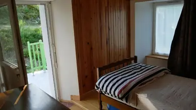 Un ou plusieurs lits dans un hébergement de l'établissement Maison accueillante à Saint-Gènes-Champespe + Vue sur le lac
