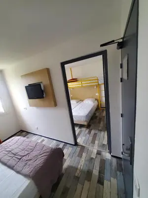 Un ou plusieurs lits dans un hébergement de l'établissement Welcomotel Limoges