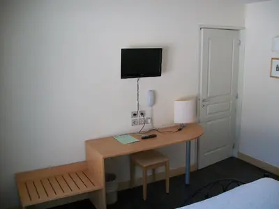 Télévision ou salle de divertissement dans l'établissement Lac des Graves
