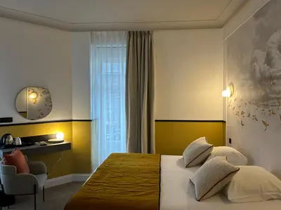 Un ou plusieurs lits dans un hébergement de l'établissement Le Grand Hôtel Mont Dore