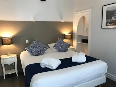 Un ou plusieurs lits dans un hébergement de l'établissement Le Grand Hôtel Mont Dore