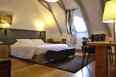 Un ou plusieurs lits dans un hébergement de l'établissement La Maison Des Jardins